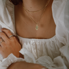 Gold necklaces on woman's neck