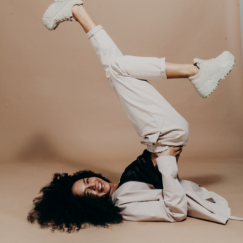Person kicking legs up with chunky sneakers