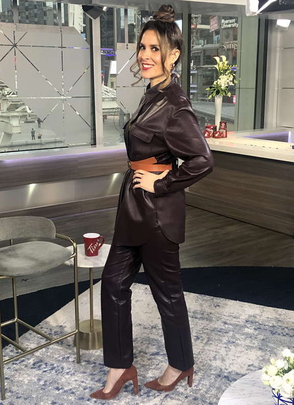 Dina wearing dark brown leather belted top with pants