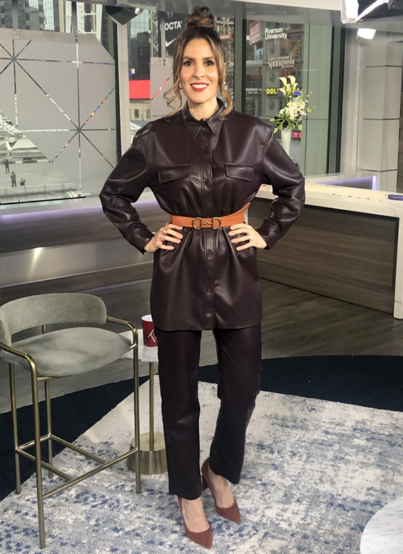 Dina wearing dark brown leather belted top with pants