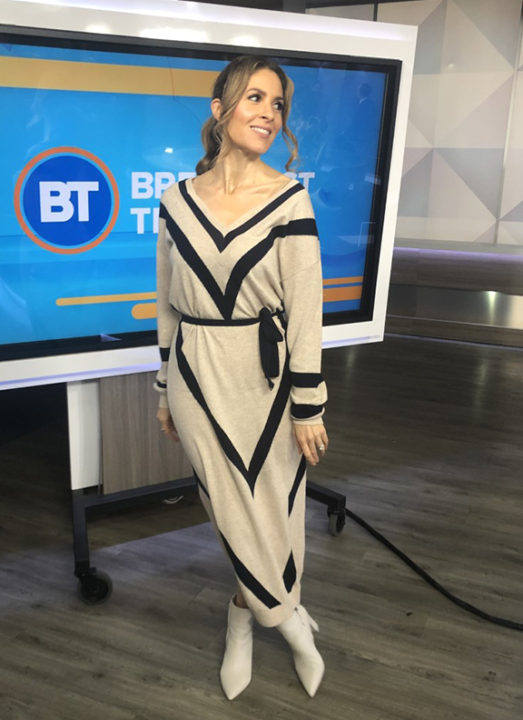 Dina wearing v-shaped long dress with white pointy boots - 2